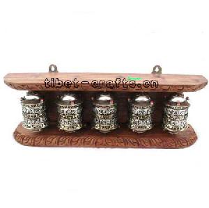 wooden sculpture prayer wheels