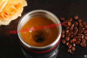 stirring camera lens coffee cup