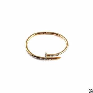 Gold Decorated Stainless Steel Nail Bangle With Fully Imbeded Zirconias