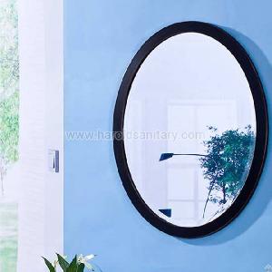 metal framed wall mounted round mirror