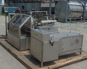 intermittent motion tray former packer