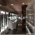 Jewellery Shops Designs With White Glossy Wall Cabinet And Tower