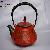 The Red Cast Iron Tea Pot