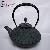 The Traditional Cast Iron Tea Pot With Floating-point